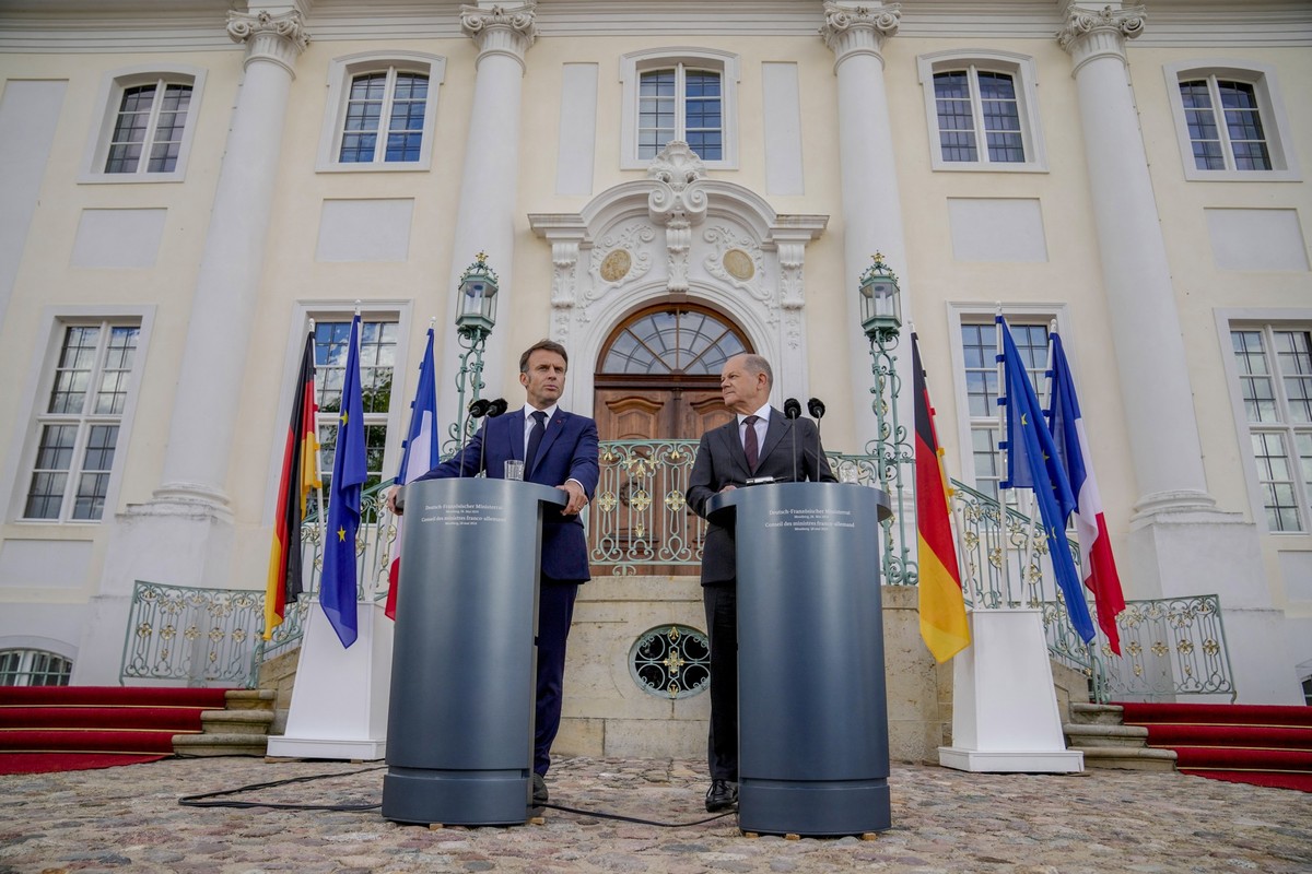 German Chancellor Olaf Scholz, right, and French President Emmanuel Macron attend a press conference at the German government guest house in Meseberg, north of Berlin, Germany, Tuesday, May 28, 2024.  ...