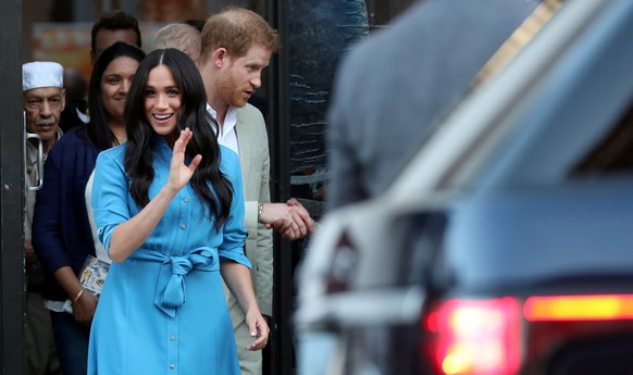 Britain's Prince Harry and Meghan, Duchess of Sussex, leave the District Six Homecoming Centre on the first day of their African tour in Cape Town, South Africa September 23, 2019. REUTERS/Sumaya Hish ...