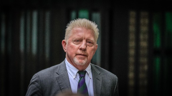 London, UK, 29th April 2022. Former tennis ace Boris Becker, with girlfriend Lilian de Carvalho, walks up to Southwark Crown Court where he is due to be sentenced today. Becker is facing the potential ...