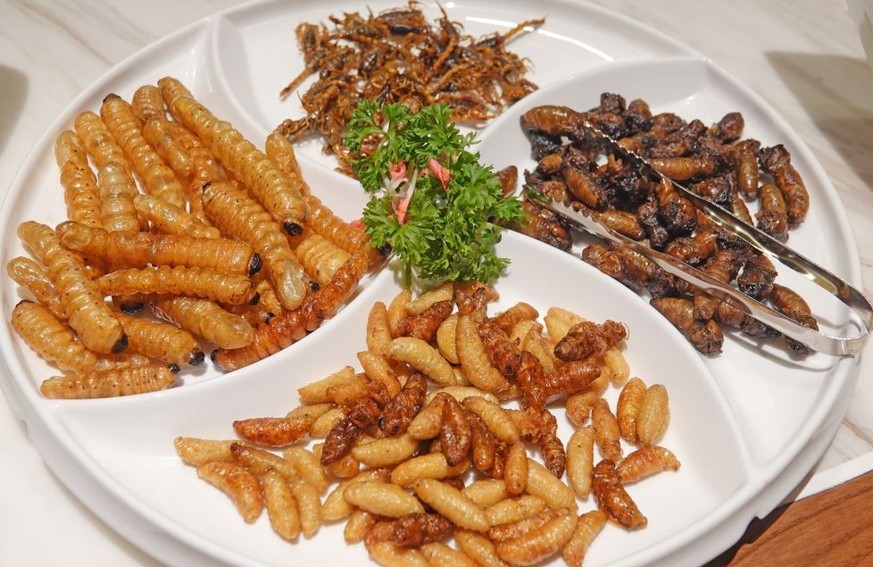 YANTAI, CHINA - OCTOBER 4, 2022 - Fried silkworm pupae are seen at a restaurant in Yantai, Shandong province, China, on Oct 4, 2022. (Photo credit should read CFOTO/Future Publishing via Getty Images)