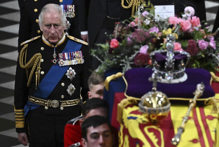 Britain&#039;s King Charles III walks behind the coffin of Queen Elizabeth II in Westminster Abbey in central London, Monday Sept. 19, 2022. The Queen, who died aged 96 on Sept. 8, will be buried at W ...