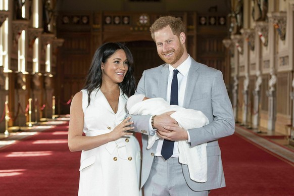 FILE - Britain's Prince Harry and Meghan, Duchess of Sussex, pose with their newborn son Archie Harrison Mountbatten-Windsor in St George's Hall at Windsor Castle, Windsor, south England, on May 8, 20 ...