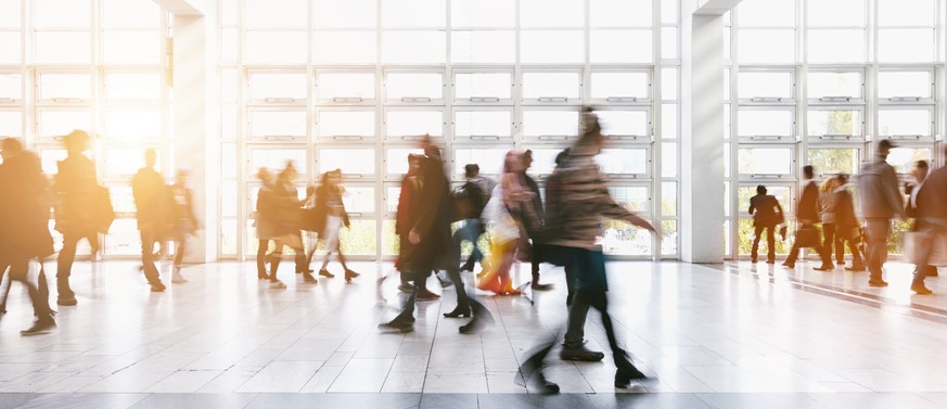 abstract blurred businnes people rushing on a floor. ideal for websites and magazines layouts