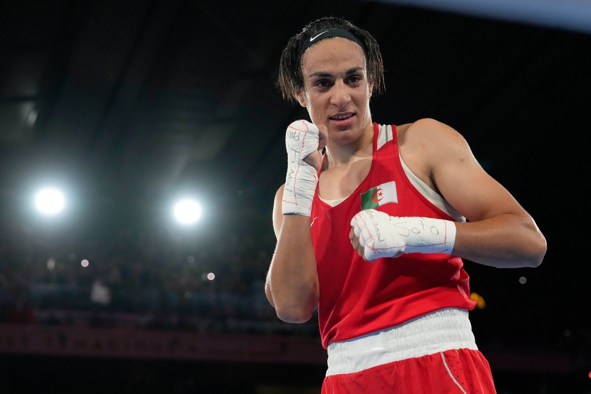 Algeria&#039;s Imane Khelif poses after defeating China&#039;s Yang Liu to win gold in their women&#039;s 66 kg final boxing match at the 2024 Summer Olympics, Friday, Aug. 9, 2024, in Paris, France.  ...