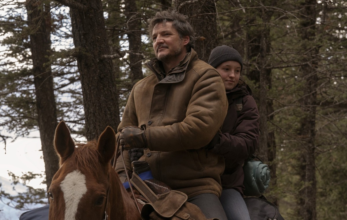 This image released by HBO shows Pedro Pascal, left, and Bella Ramsey in a scene from &quot;The Last of Us.&quot; (HBO via AP)