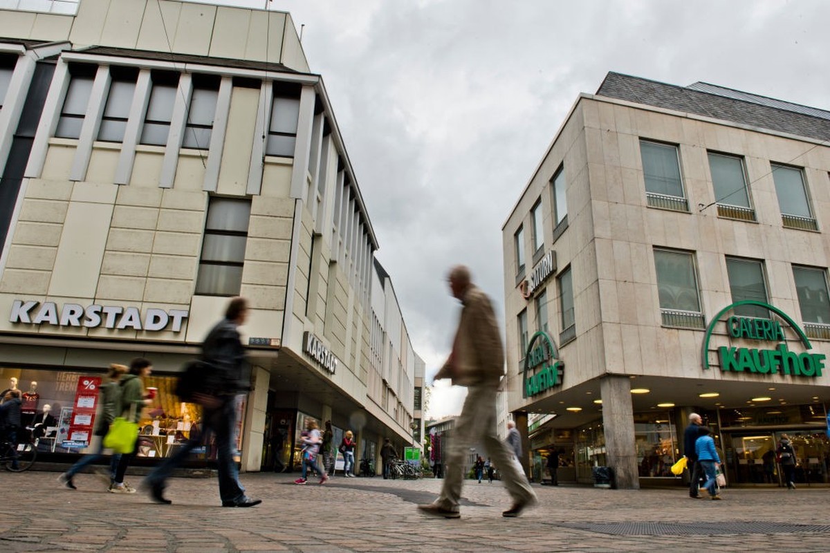 TRIER, GERMANY - SEPTEMBER 07: Branches of German department store chains Karstadt and Galeria Kaufhof stand opposite one another in a shopping street on September 7, 2018 in Trier, Germany. According ...