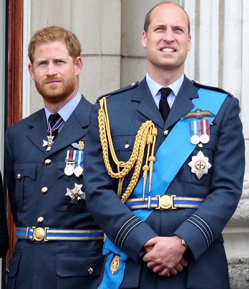 LONDON, ENGLAND - JULY 10: (L-R) Prince William, Duke of Cambridge and Prince Harry, Duke of Sussex watch the RAF flypast on the balcony of Buckingham Palace, as members of the Royal Family attend eve ...