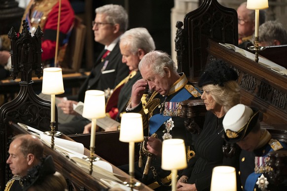 King Charles III, center, attend the committal service for Britain&#039;s Queen Elizabeth II at St George&#039;s Chapel, Windsor Castle, in Windsor, England, Monday, Sept. 19, 2022. (Joe Giddens/Pool  ...