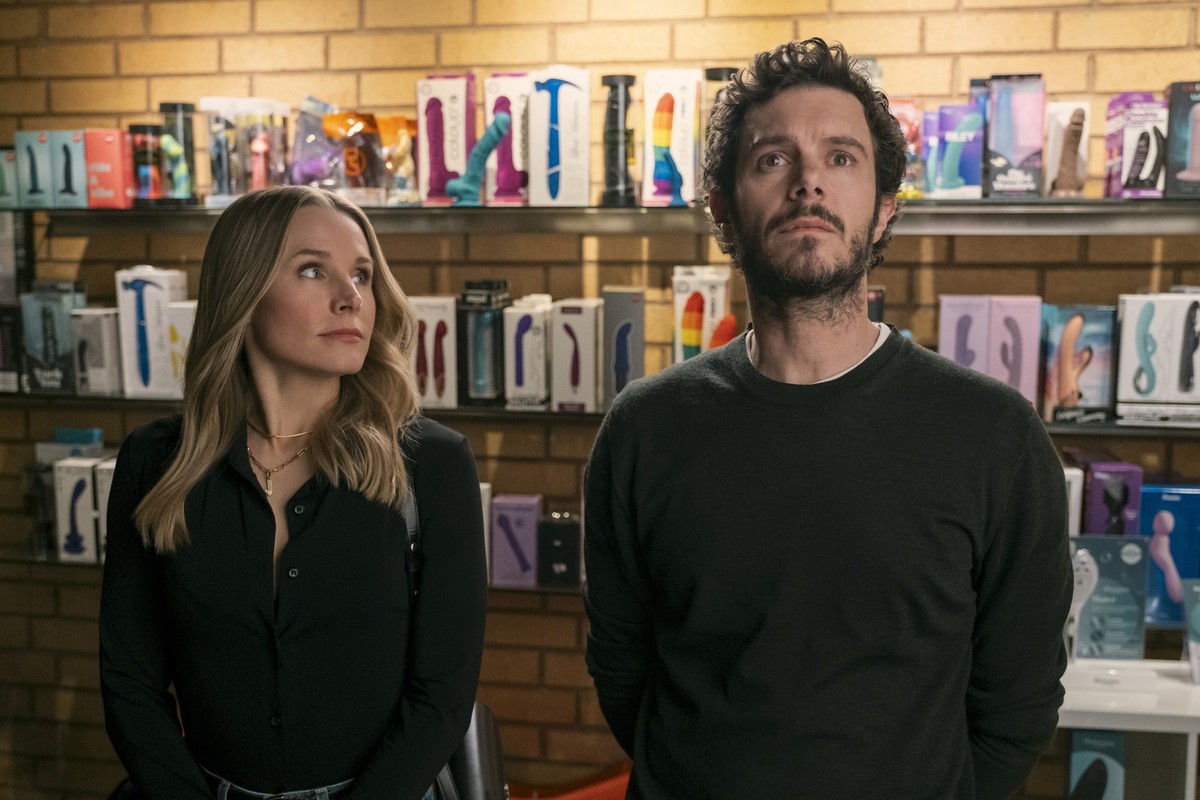 This image released by Netflix shows Kristen Bell, left, and Adam Brody in a scene from &quot;Nobody Wants This.&quot; (Adam Rose/Netflix via AP)