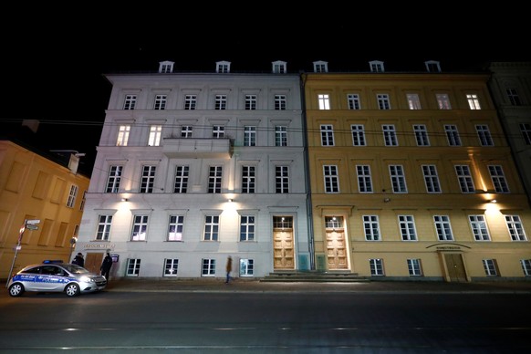 Police guards a house where German Chancellor Angela Merkel has an apartment, in Berlin, Germany, March 22, 2020. Merkel will go into quarantine after coming into contact with a doctor who had tested  ...