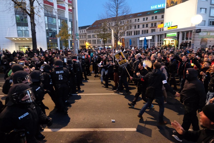 After the demonstration of the Stuttgart initiative &quot;Lateral thinking&quot;, participants face police officers in Leipzig, Germany, Saturday, Nov. 7, 2020. Several thousand people took part in th ...