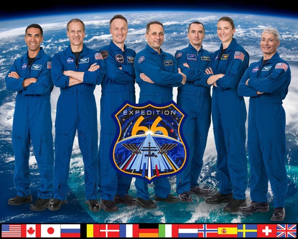 iss066-s-002 (May 20, 2021) --- The official portrait of the seven-member Expedition 66 crew. From left are, NASA astronauts Raja Chari and Thomas Marshburn; ESA (European Space Agency) astronaut Matt ...