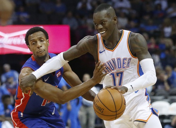 Oklahoma City Thunder guard Dennis Schroeder (17) drives around Detroit Pistons guard Ish Smith during the second half of an NBA preseason basketball game in Oklahoma City, Wednesday, Oct. 3, 2018. (A ...