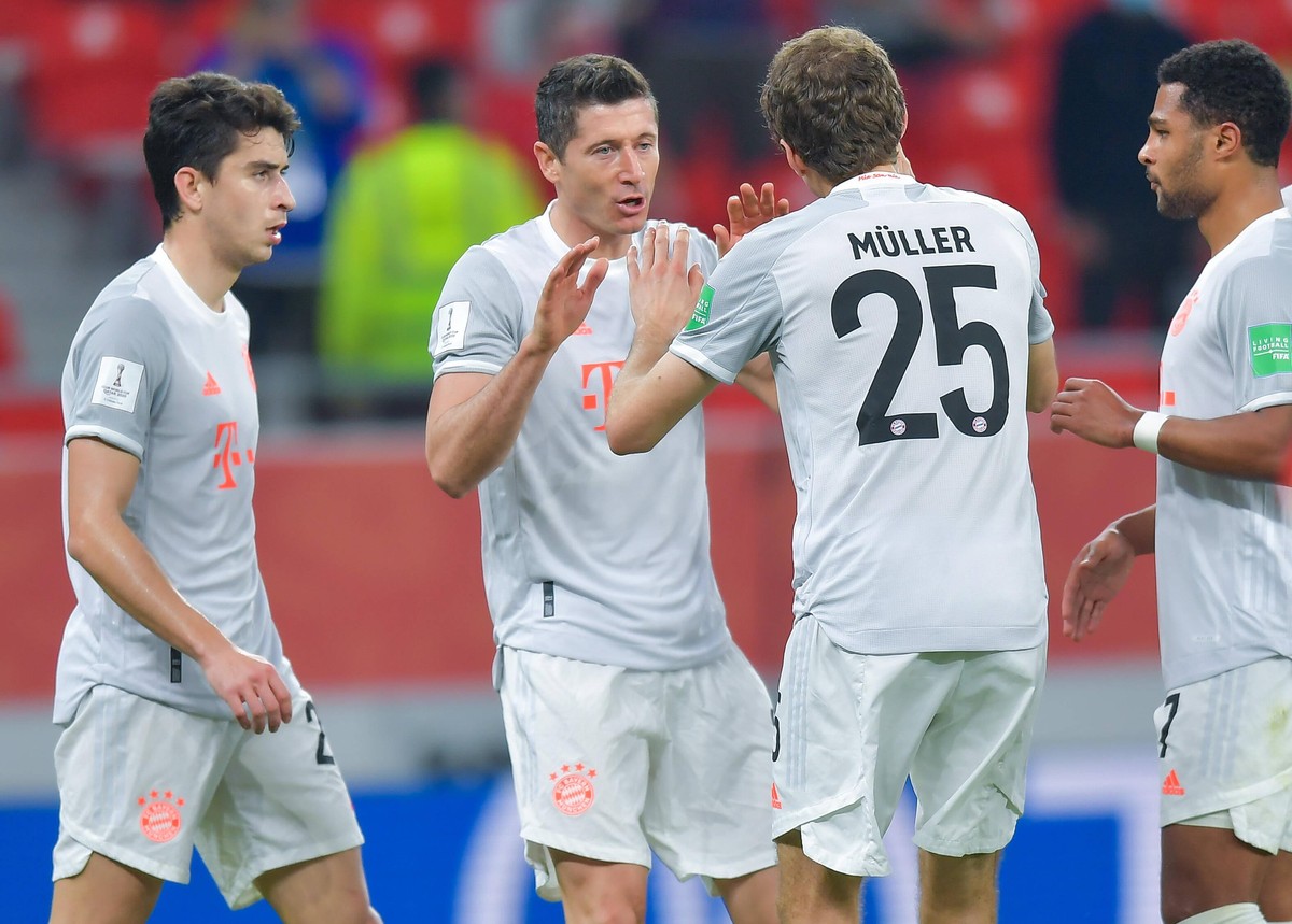 210209 -- DOHA, Feb. 9, 2021 -- Robert Lewandowski 2nd L of Bayern Munich celebrates scoring with teammates during the FIFA Club World Cup semi-final football match between Egypt s Al Ahly and Germany ...