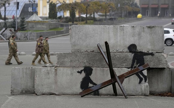 Banksy-esque artwork in Kyiv Photo taken on Nov. 6, 2022, in Ukraine s capital Kyiv, shows graffiti resembling British street artist Banksy s work, although not verified, that has appeared near Indepe ...