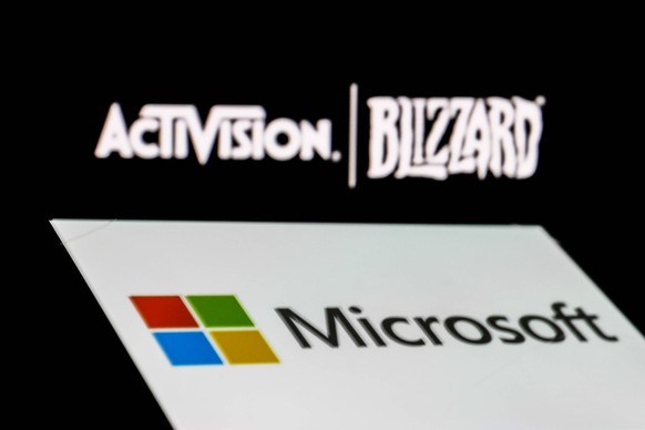 Activision Blizzard And Microsoft Photo Illustrations Activision Blizzard logo displayed on a laptop screen and Microsoft logo displayed on a phone screen are seen this illustration photo taken in Kra ...
