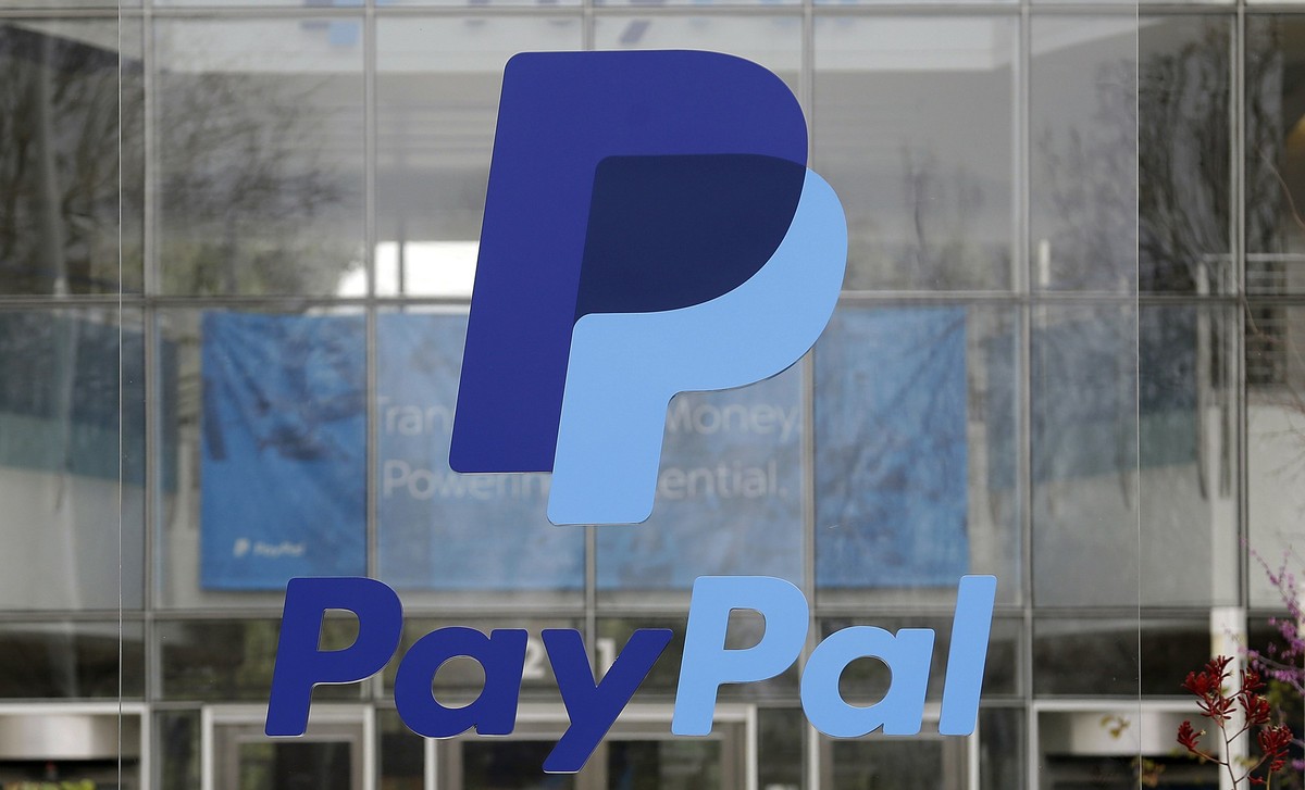 FILE - The PayPal logo hangs displayed outside their company headquarters on March 10, 2015, in San Jose, Calif. Customers of PayPal, Venmo and CashApp should not store their money for the long term w ...