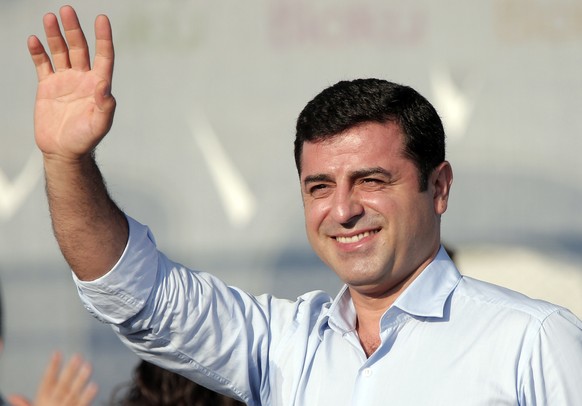 FILE - In this Sunday, Aug. 9, 2015 file photo, Selahattin Demirtas, then leader of the pro Kurdish Democratic Party of Peoples (HDP) waves to people gathered for a pro-peace rally in Istanbul. Demirt ...