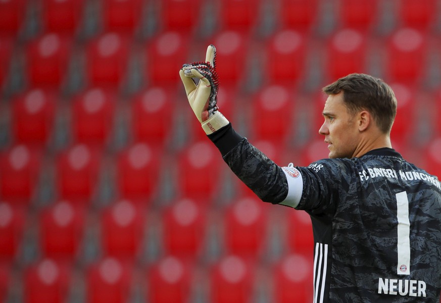 Munich&#039;s goal keeper Manuel Neuer gestures during the German Bundesliga soccer match between Union Berlin and Bayern Munich in Berlin, Germany, Sunday, May 17, 2020. The German Bundesliga becomes ...