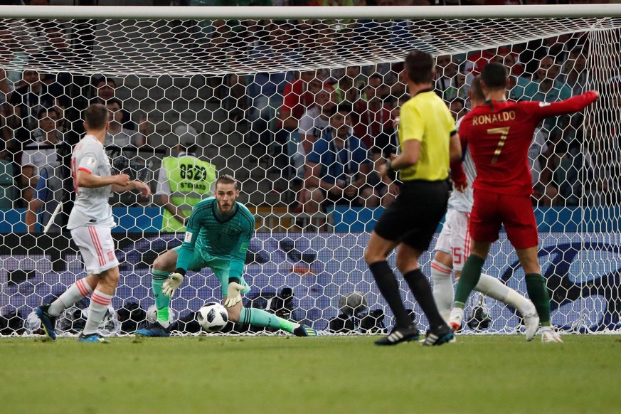 Spanish goalkeeper De Gea tries to stop the ball during the FIFA World Cup WM Weltmeisterschaft Fussball 2018 Group B soccer match between Portugal and Spain, in Sochi, Russia, 15 June 2018. PORTUGAL  ...