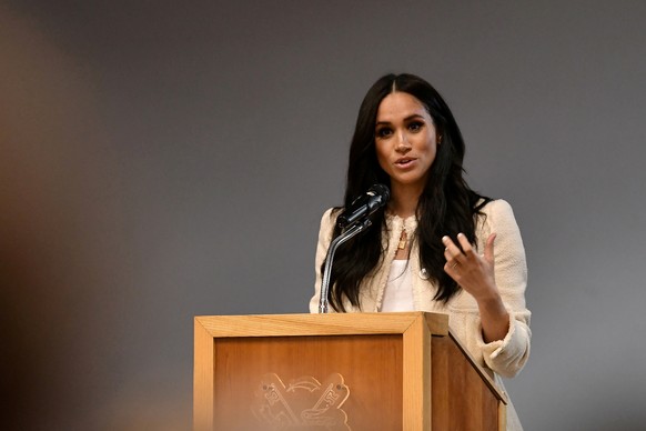 FILE PHOTO: Britain's Meghan, Duchess of Sussex speaks during a school assembly as part of a visit to Robert Clack School in Essex, Britain March 6, 2020, in support of International Women's Day. Ben  ...