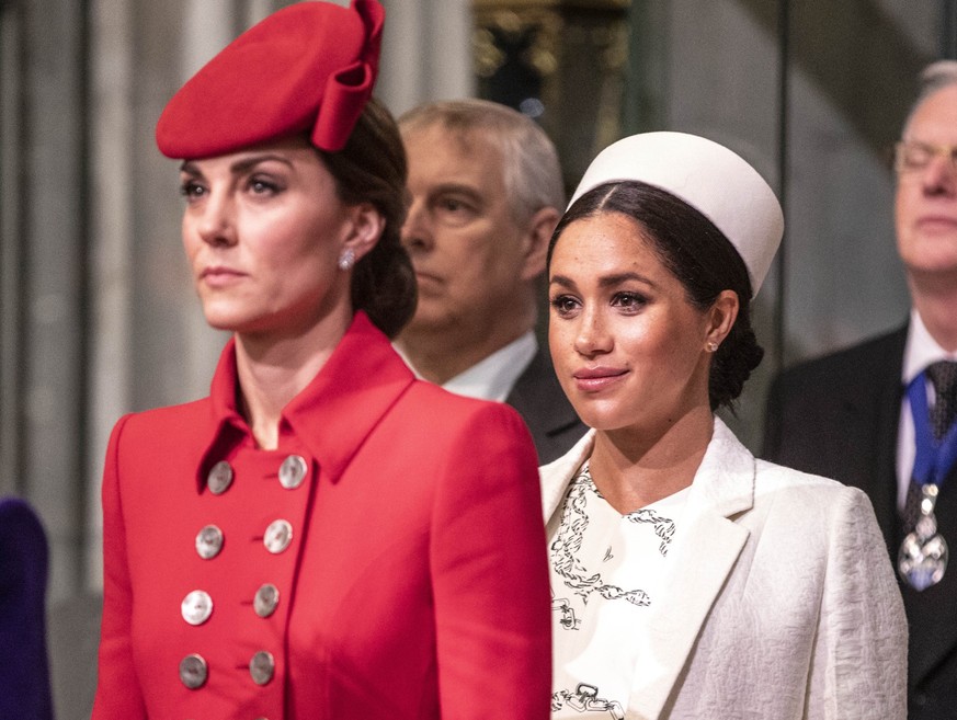 LONDON, ENGLAND - MARCH 11: Catherine, The Duchess of Cambridge stands with Meghan, Duchess of Sussex at Westminster Abbey for a Commonwealth day service on March 11, 2019 in London, England. Commonwe ...