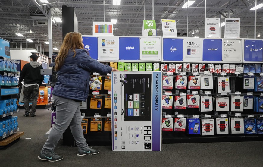 CHICAGO, IL - NOVEMBER 22: A shopper looks for electronics at a Best Buy Inc. store on November 22, 2018 in Chicago, Illinois. Known as &#039;Black Friday&#039;, the day after Thanksgiving marks the b ...