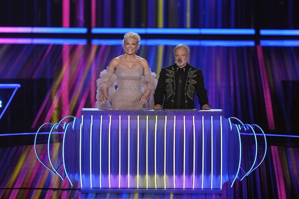 Presenters Hannah Waddingham, left, and Graham Norton during the Grand Final of the Eurovision Song Contest in Liverpool, England, Saturday, May 13, 2023. (AP Photo/Martin Meissner)