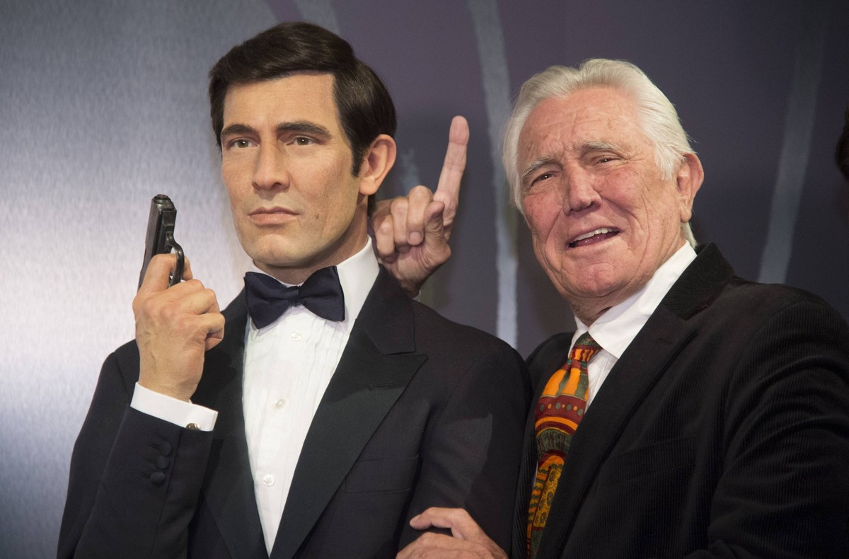 Actor George Lazenby participates in the unveiling of the Wax figures of all six James Bonds now displayed at Madame Tussauds Hollywood in the Hollywood section of Los Angeles on December 15, 2015. La ...