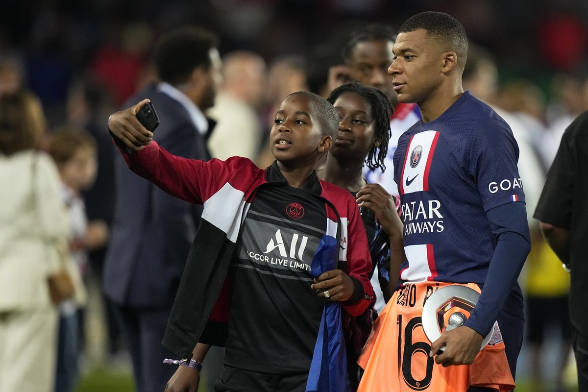 PSG&#039;s Kylian Mbappe is taken a photograph after the French League One soccer match between Paris Saint-Germain and Clermont at the Parc des Princes in Paris, France, Saturday, June 3, 2023. (AP P ...