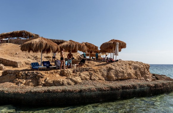 Tourist enjoy sunshine at the beach in the resort town of Sharm El Sheikh on Red Sea coast in South Sinai, Egypt on November 14, 2022. Sharm El Sheikh is well known for its coral wildlife and oriental ...