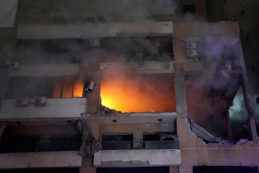 Smoke and flame rise from a destroyed apartment as following a massive explosion in the southern suburb of Beirut, Lebanon, Tuesday, Jan. 2, 2024. The TV station of Lebanon&#039;s Hezbollah group says ...