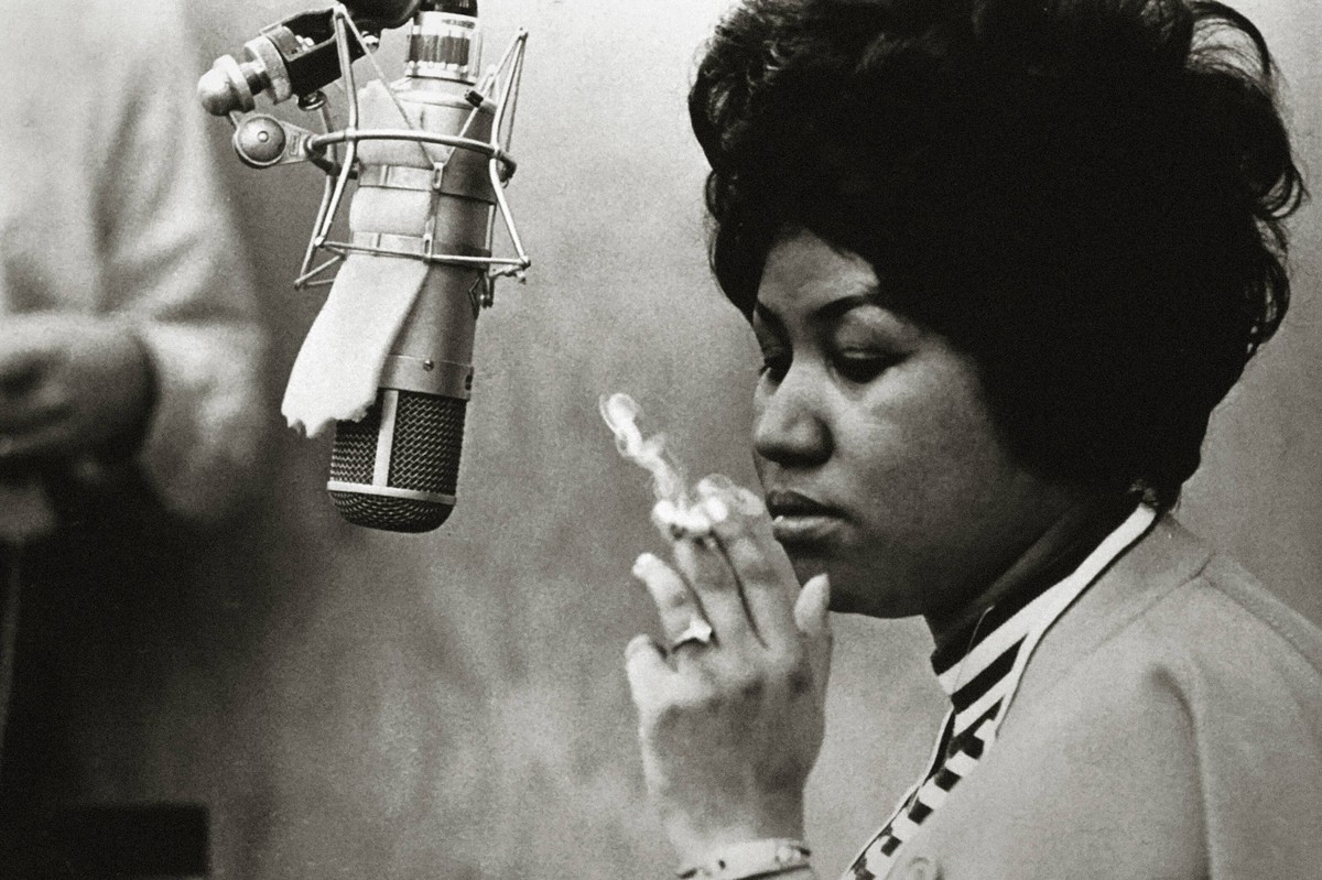 Publicity photo of Aretha Franklin in front of a microphone at a recording studio while smoking a cigarette, circa 1967. File Reference 32914_999THA Hollywood CA USA PUBLICATIONxINxGERxSUIxAUTxONLY Co ...