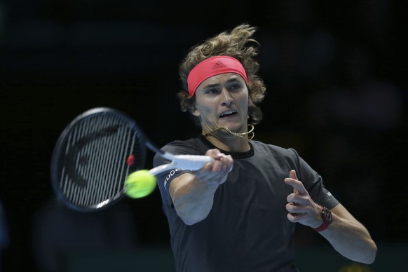 Alexander Zverev of Germany returns to Novak Djokovic of Serbia in their ATP World Tour Finals singles final tennis match at the O2 Arena in London, Sunday Nov. 18, 2018. (AP Photo/Tim Ireland)