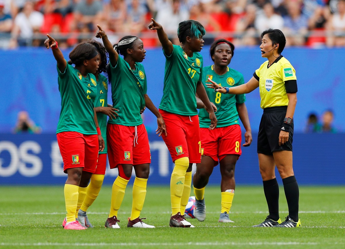 Soccer Football - Women's World Cup - Round of 16 - England v Cameroon - Stade du Hainaut, Valenciennes, France - June 23, 2019 Cameroon's Gaelle Enganamouit, Raissa Feudjio and team mates r ...
