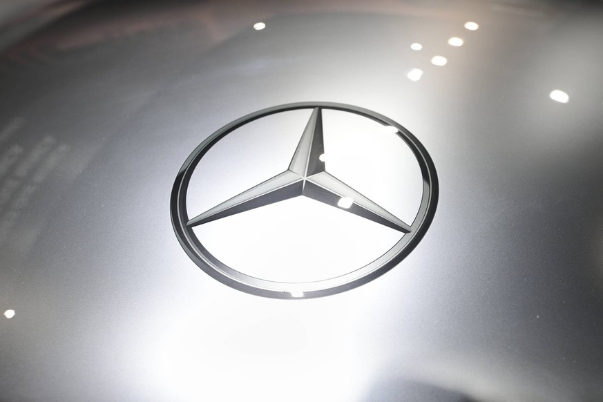 Automobile Barcelona International Motor Show BARCELONA, SPAIN - May 19: The Mercedes-Benz logo, the Stuttgart-based German luxury and commercial automotive brand, exhibited on a silver grey backgroun ...