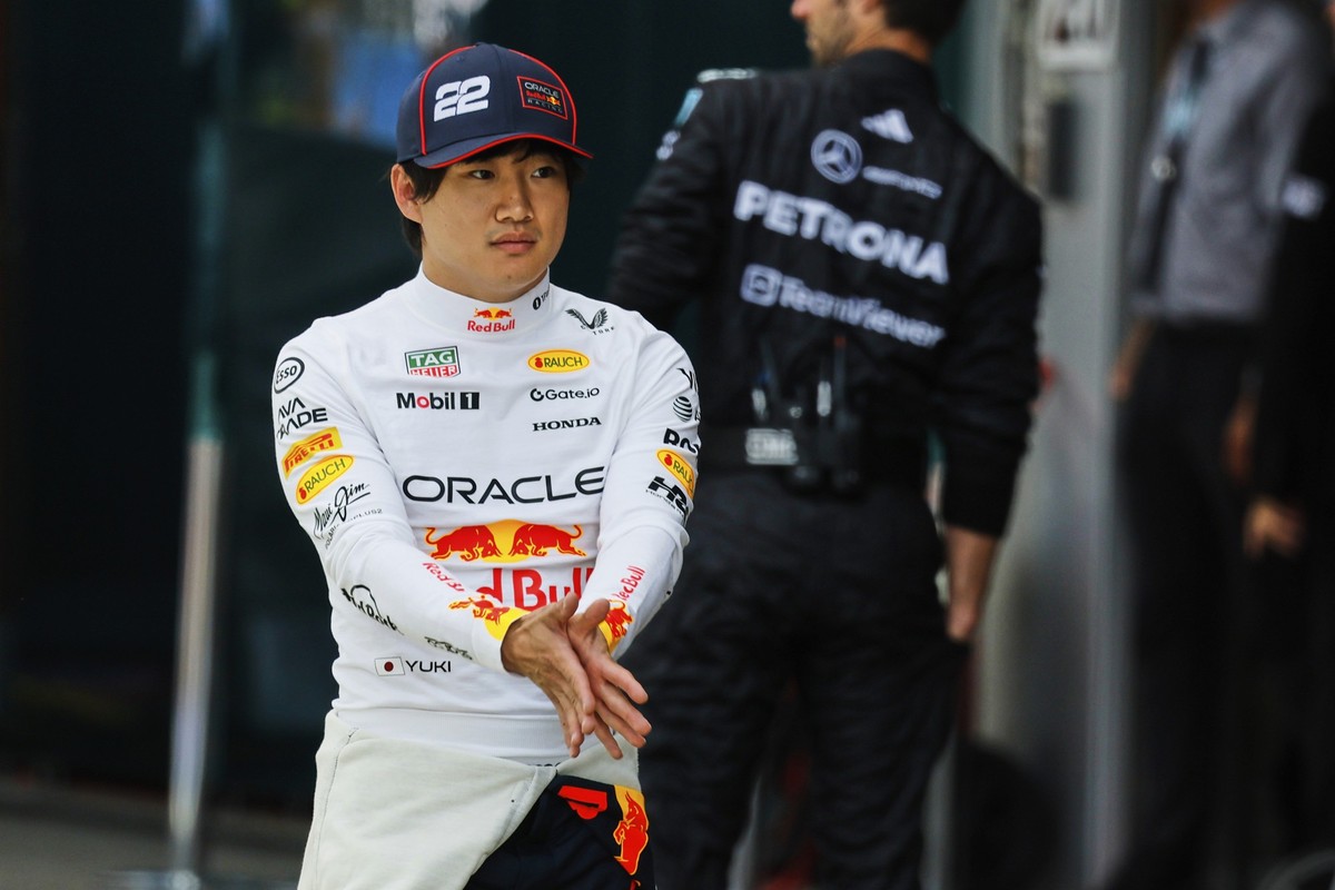Red Bull driver Yuki Tsunoda of Japan walks near the team garage prior to the sprint race ahead of the Formula One Grand Prix at the Spa-Francorchamps racetrack in Spa, Belgium, Saturday, July 26, 202 ...