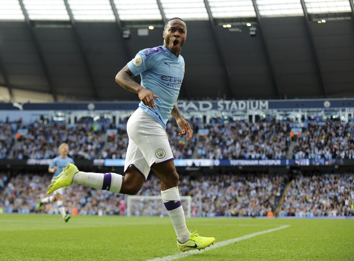 FILE - Manchester City's Raheem Sterling celebrates after scoring his side's opening goal during the English Premier League soccer match between Manchester City and Tottenham Hotspur at Etih ...