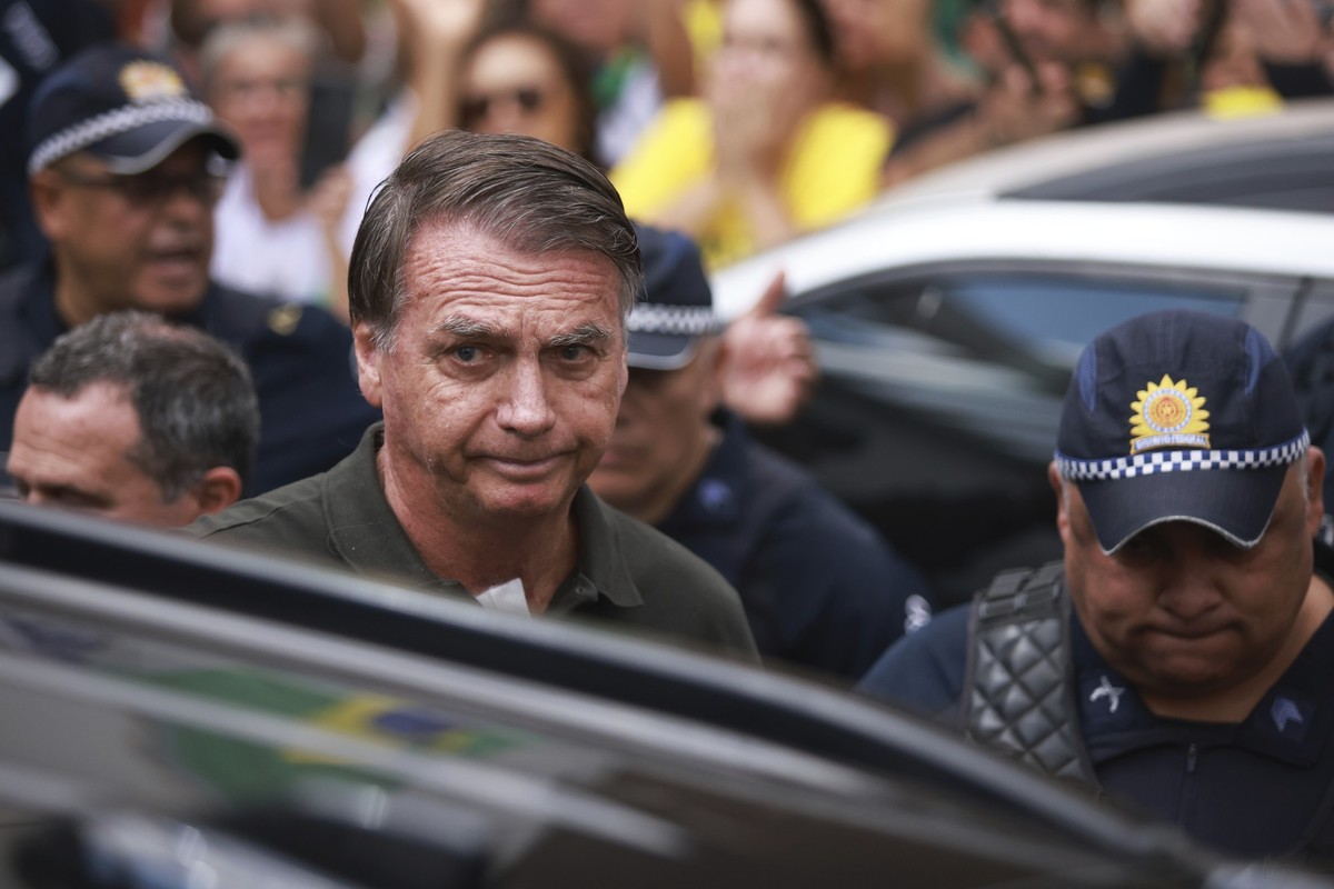 Former President Jair Bolsonaro, temporarily allowed out of house arrest for medical treatment, departs a hospital in Brasilia, Brazil, Sunday, Sep. 14, 2025. (AP Photo/Luis Nova)