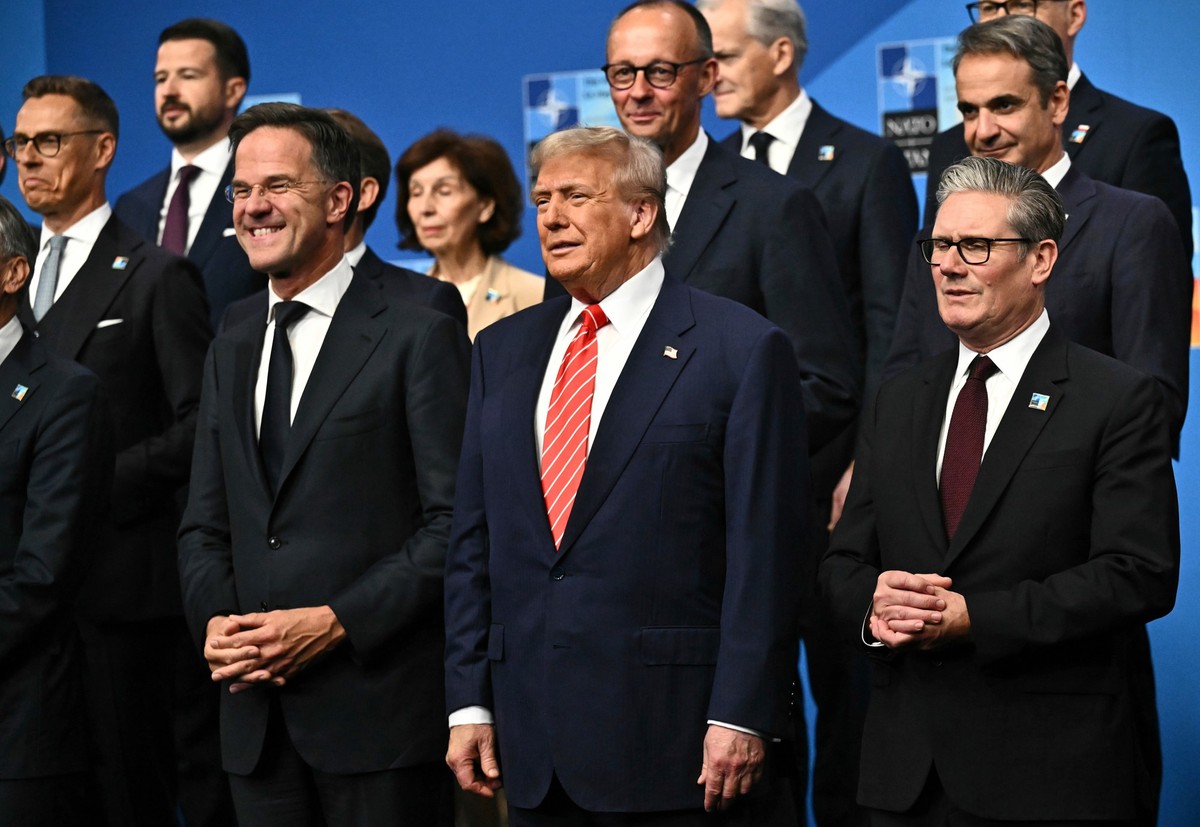 NATO Secretary General Mark Rutte, from left, President Donald Trump and Britain's Prime Minister Keir Starmer pose with NATO country leaders for a family photo during the NATO summit in The Hagu ...