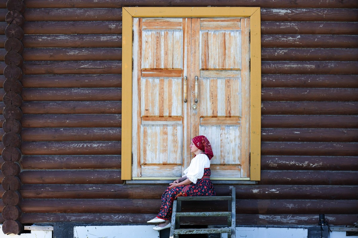 RUSSIA, NOVOSIBIRSK REGION - JUNE 23, 2024: A woman wears a traditional dress during the Great Lokti Circle Dance interregional festival held in the village of Lokti, northeast of Novosibirsk, to mark ...
