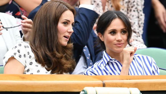 LONDON, ENGLAND - JULY 14: Catherine, Duchess of Cambridge and Meghan, Duchess of Sussex attend day twelve of the Wimbledon Lawn Tennis Championships at All England Lawn Tennis and Croquet Club on Jul ...