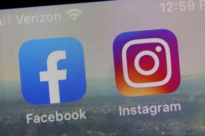 FILE - This photo shows the mobile phone app logos for, from left, Facebook and Instagram in New York, Oct. 5, 2021. British lawmakers have on Wednesday, Sept. 20, 2023 approved an ambitious but contr ...