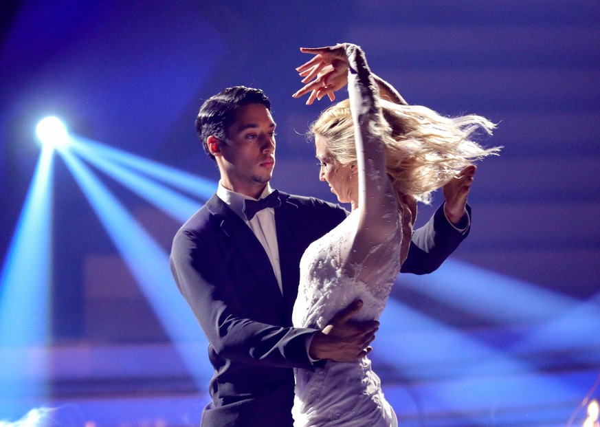 COLOGNE, GERMANY - FEBRUARY 25: René Casselly and Kathrin Menzinger perform on stage during the 1st show of the 15th season of the television competition show &quot;Let&#039;s Dance&quot; at MMC Studi ...