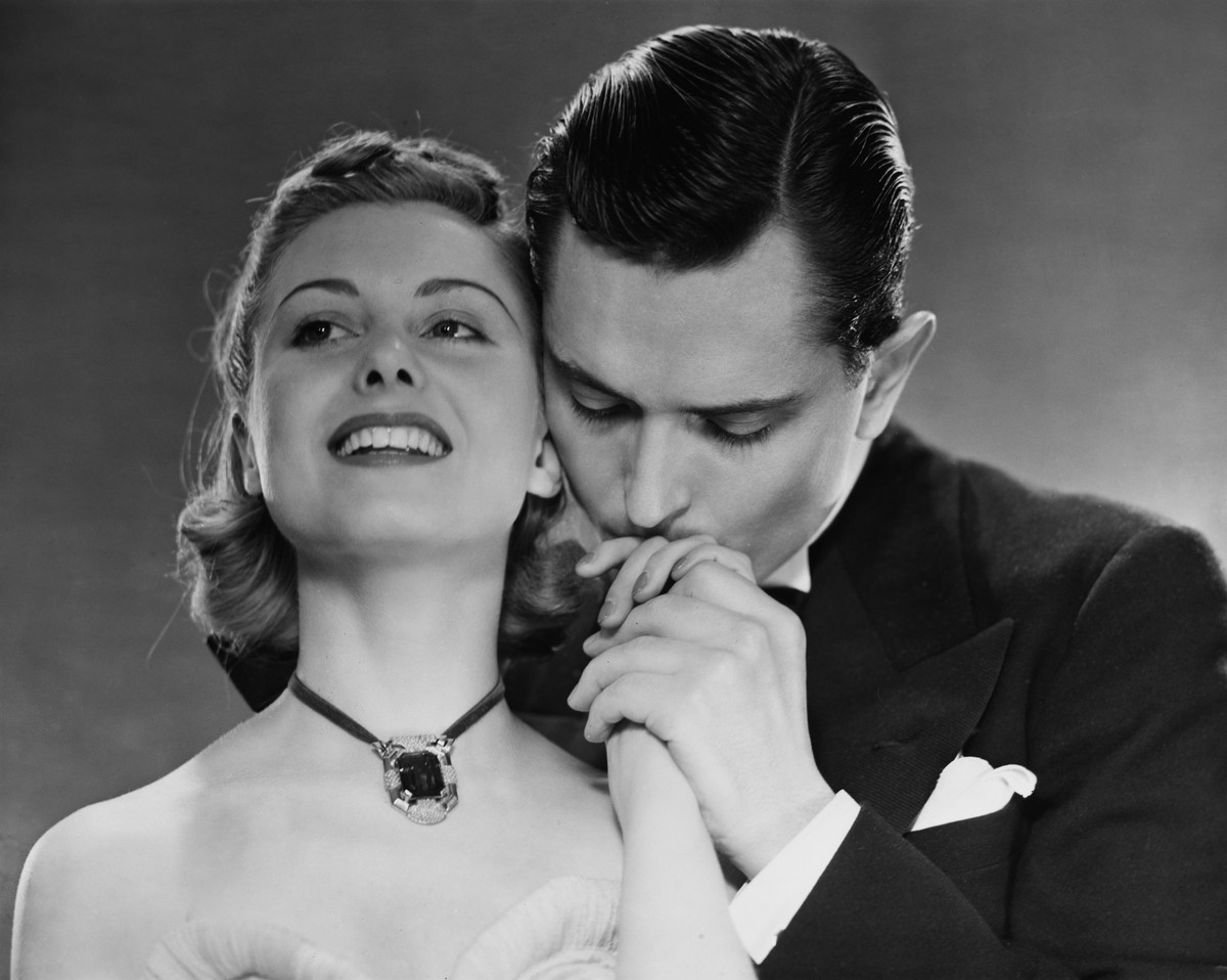 A young man kisses the hand of his partner, circa 1950. (Photo by George Marks/Retrofile/Getty Images)
