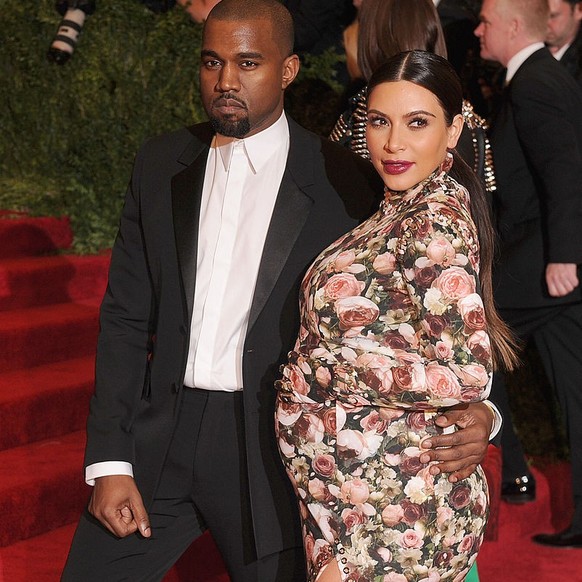 NEW YORK, NY - MAY 06: Kim Kardashian and Kanye West attend the 2013 Costume Institute Gala - PUNK: Chaos to Couture at Metropolitan Museum of Art on May 6, 2013 in New York City. (Photo by Dimitrios  ...