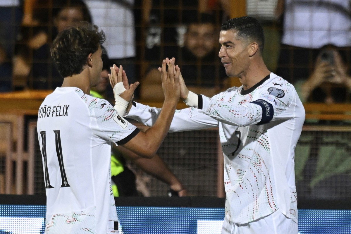 Portugal&#039;s Cristiano Ronaldo, right, celebrates with Joao Felix after scoring his side&#039;s fourth goal during a World Cup 2026 group F qualifying soccer match between Armenia and Portugal at t ...