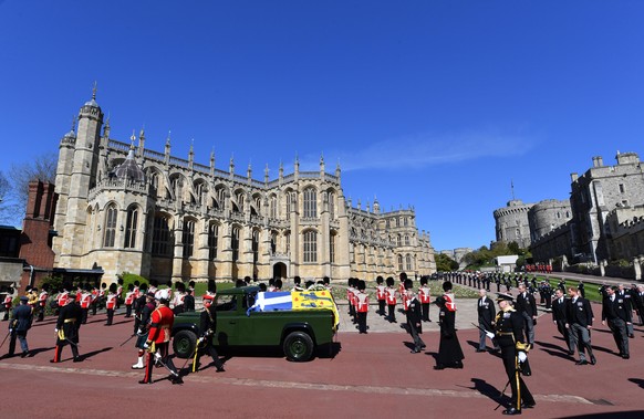 WINDSOR, ENGLAND - APRIL 17: Prince Charles, Prince of Wales and other royal family members walk behind The Duke of Edinburgh’s coffin, covered with His Royal Highness’s Personal Standard, during the  ...