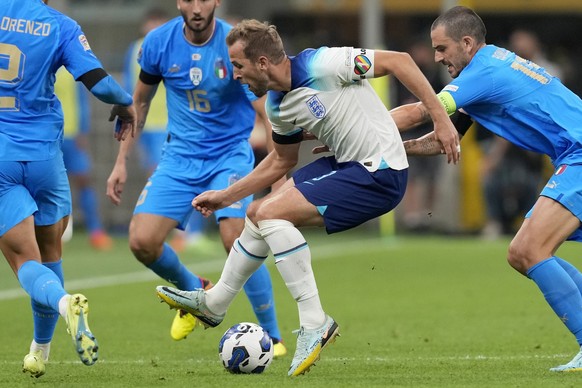 FILE - England's Harry Kane, center, wearing a rainbow armband, controls the ball during the UEFA Nations League soccer match between Italy and England at the San Siro stadium, in Milan, Italy, on Sep ...