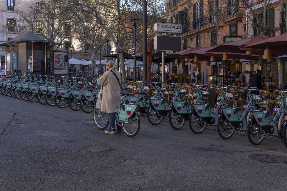 Palma de Mallorca, Spain; april 03 2023: Bicycles of the public rental company Bicipalma, parked on the street in the historic center of Palma de Mallorca, Spain